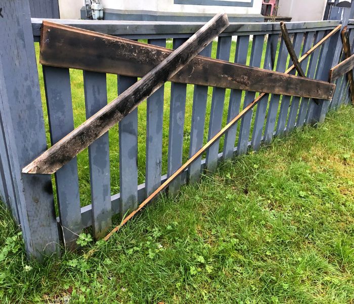 image of poorly repaired fence